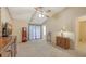 A bright bedroom with a ceiling fan and carpet flooring at 4308 Kingston Loop, Sarasota, FL 34238