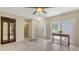 Inviting foyer featuring tile flooring, a decorative mosaic, and a console table with fresh flowers at 4308 Kingston Loop, Sarasota, FL 34238