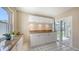Bright kitchen area with white cabinets, granite countertops, and tile flooring at 4308 Kingston Loop, Sarasota, FL 34238