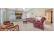 A cozy living room with a fireplace and tile flooring at 4308 Kingston Loop, Sarasota, FL 34238
