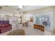 Open floor plan with living room, dining area, and sliding doors to patio with exterior dining at 4308 Kingston Loop, Sarasota, FL 34238