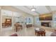 Inviting living room with fireplace, natural light, and a dining area adjacent at 4308 Kingston Loop, Sarasota, FL 34238