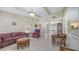 Spacious living area featuring tile flooring, plush seating, and ample natural light at 4308 Kingston Loop, Sarasota, FL 34238
