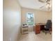 Functional office space with natural light, ceramic tile floors and a ceiling fan for added comfort at 4308 Kingston Loop, Sarasota, FL 34238