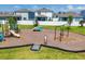 Community playground featuring play structures, swings, and a safety-surfaced play area at 4524 Pippin Ln, Lakewood Ranch, FL 34211