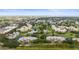 Expansive aerial view showcasing a community with lush landscaping and a golf course at 4530 Pinebrook Cir # 109, Bradenton, FL 34209