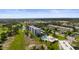 Aerial view of community with golf course, swimming pool, and well-maintained landscaping at 4530 Pinebrook Cir # 109, Bradenton, FL 34209