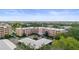 A lovely exterior shot of the condo building with ample parking, lush landscaping, and a serene atmosphere at 4530 Pinebrook Cir # 109, Bradenton, FL 34209