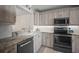 Modern kitchen with stainless steel appliances, granite countertops, and light wood cabinetry at 4530 Pinebrook Cir # 109, Bradenton, FL 34209
