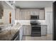 Modern kitchen with granite countertops, stainless steel appliances and ample cabinet space at 4530 Pinebrook Cir # 109, Bradenton, FL 34209