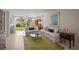 Comfortable living room featuring plush seating and a glass coffee table with outdoor access at 4530 Pinebrook Cir # 109, Bradenton, FL 34209