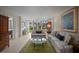 Bright living room with sliding glass doors to the backyard and comfortable seating at 4530 Pinebrook Cir # 109, Bradenton, FL 34209