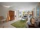 Inviting living room with serene decor, plush sofas, and a view to the lanai at 4530 Pinebrook Cir # 109, Bradenton, FL 34209