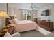 Comfortable main bedroom with soft pink accents and ample natural light at 4530 Pinebrook Cir # 109, Bradenton, FL 34209