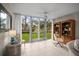 Office space featuring large sliding doors to backyard, tile floors and built in shelving at 4530 Pinebrook Cir # 109, Bradenton, FL 34209
