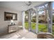 Bright sunroom with tiled floors and sliding glass doors leading to the outdoors at 4530 Pinebrook Cir # 109, Bradenton, FL 34209