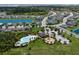 Aerial view showcasing the community pool, playground, and mature tropical landscaping at 4739 Reisswood Loop, Palmetto, FL 34221
