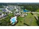 Aerial view showcasing the community pool, playground, and lush tropical landscaping at 4739 Reisswood Loop, Palmetto, FL 34221