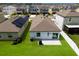 Backyard with lush green grass, a patio, privacy fence, and modern outdoor grill at 4739 Reisswood Loop, Palmetto, FL 34221