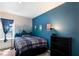 Bedroom features a mountain mural on the wall, colorful décor, and built in shelving at 4739 Reisswood Loop, Palmetto, FL 34221