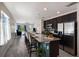 Open kitchen featuring a large island with seating, stainless steel appliances, and tile flooring at 4739 Reisswood Loop, Palmetto, FL 34221