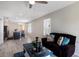 Open living space with tile flooring, soft natural light, and a cohesive design that flows seamlessly at 4739 Reisswood Loop, Palmetto, FL 34221
