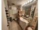 Cozy bathroom featuring a single sink vanity, window, toilet, and shower at 5301 Algeria Ct, Bradenton, FL 34207