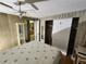 Cozy bedroom offering storage, ceiling fan, hardwood flooring, and closet at 5301 Algeria Ct, Bradenton, FL 34207