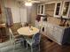 Cozy dining area features a round table with chairs, ample cabinet storage at 5301 Algeria Ct, Bradenton, FL 34207