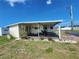 Charming single-story home with a covered carport and cozy front yard, offering a welcoming curb appeal at 5301 Algeria Ct, Bradenton, FL 34207