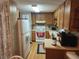 Traditional kitchen with wood cabinetry, white appliances, and durable countertops at 5301 Algeria Ct, Bradenton, FL 34207