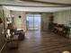 Spacious living room with modern floors, providing a comfortable area for relaxation and entertainment at 5301 Algeria Ct, Bradenton, FL 34207