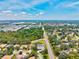 Wide aerial view of the neighborhood showing the surrounding area and nearby roadways at 5373 Anthony Ln, Sarasota, FL 34233
