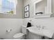 Bathroom featuring a white subway tile backsplash, and neutral walls, sink, and toilet at 5373 Anthony Ln, Sarasota, FL 34233