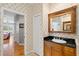 Charming bathroom features a decorative mirror and a granite countertop at 5373 Anthony Ln, Sarasota, FL 34233