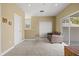 Spacious bonus room filled with natural light, carpeted floor, and neutral colored walls at 5373 Anthony Ln, Sarasota, FL 34233