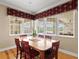 Elegant dining room features a large window with scenic views and ample seating for Gathering gatherings at 5373 Anthony Ln, Sarasota, FL 34233