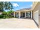 Charming home showcasing a front porch with stately columns and beautiful landscaping at 5373 Anthony Ln, Sarasota, FL 34233