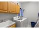 Functional laundry room featuring modern appliances and ample storage at 5373 Anthony Ln, Sarasota, FL 34233