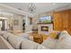 Comfortable living room with stone fireplace and large sectional sofa at 5373 Anthony Ln, Sarasota, FL 34233
