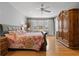 Serene main bedroom with light walls, wood floors, and plenty of natural light at 5373 Anthony Ln, Sarasota, FL 34233