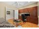 Comfortable home office with custom built-in wooden desk and storage cabinets at 5373 Anthony Ln, Sarasota, FL 34233