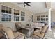 A cozy outdoor living space featuring comfortable seating around a rustic fire pit, perfect for relaxing evenings at 5373 Anthony Ln, Sarasota, FL 34233