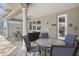 Covered patio features a dining set and exterior lounge seating at 5373 Anthony Ln, Sarasota, FL 34233