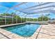 A sparkling screened-in pool and spa offer a luxurious outdoor experience at 5373 Anthony Ln, Sarasota, FL 34233