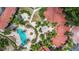Overhead shot of a sparkling pool, fountains, and tropical landscaping, highlighting the community's recreational amenities and outdoor spaces at 5401 Bentgrass Dr # 1-113, Sarasota, FL 34235