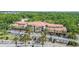 Aerial view showing the beautiful community's attractive architecture, parking and landscaping at 5401 Bentgrass Dr # 1-113, Sarasota, FL 34235