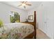 Light and airy bedroom with a window view and a four-poster bed at 5401 Bentgrass Dr # 1-113, Sarasota, FL 34235