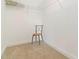 Walk-in closet with wire shelving and neutral carpet at 5401 Bentgrass Dr # 1-113, Sarasota, FL 34235