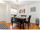 Dining room featuring a dark wood table, a chandelier, and neutral decor at 5401 Bentgrass Dr # 1-113, Sarasota, FL 34235